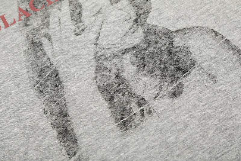 Close-up of printed portrait on gray tee