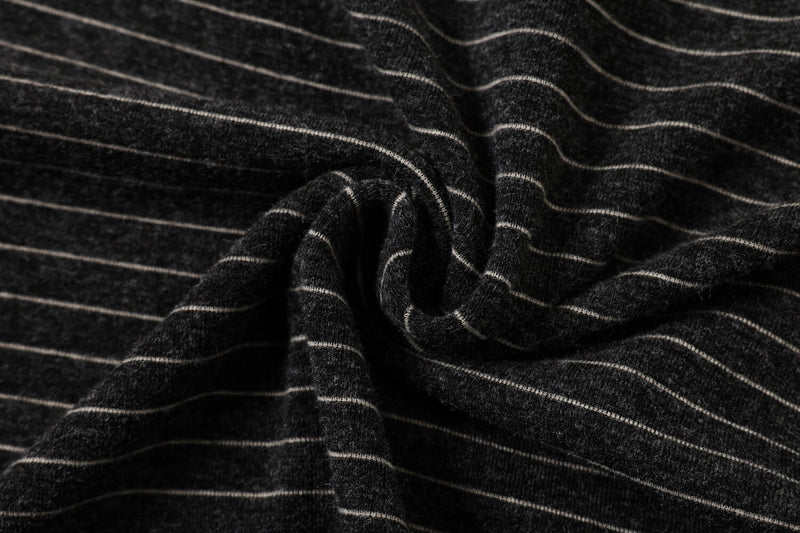 Close-up of black striped knit fabric with soft texture, showcasing the Seakoff Pegasus streetwear tee material