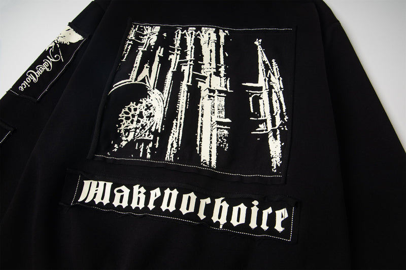 Back of black hoodie with graphic panel and white gothic text
