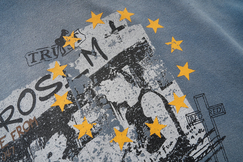Close-up of back graphic showing stars and distressed rock print on hoodie