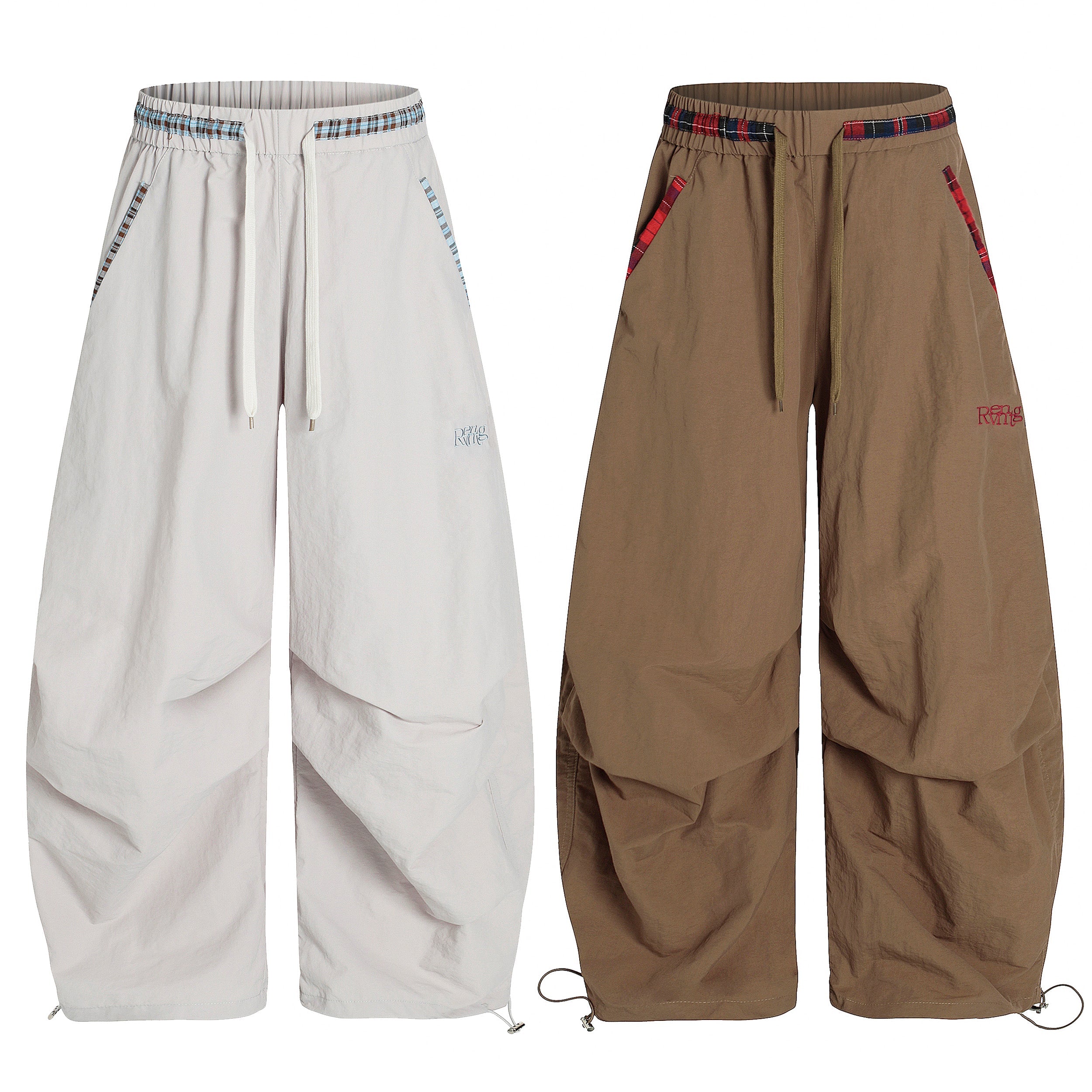 Omirad nylon stacked wide-leg pants in off-white and khaki with plaid-trim waistband and pockets, shown front view