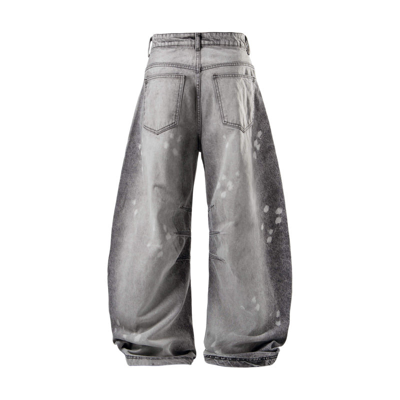 Back view of washed gray wide-leg jeans with faded finish and back pockets