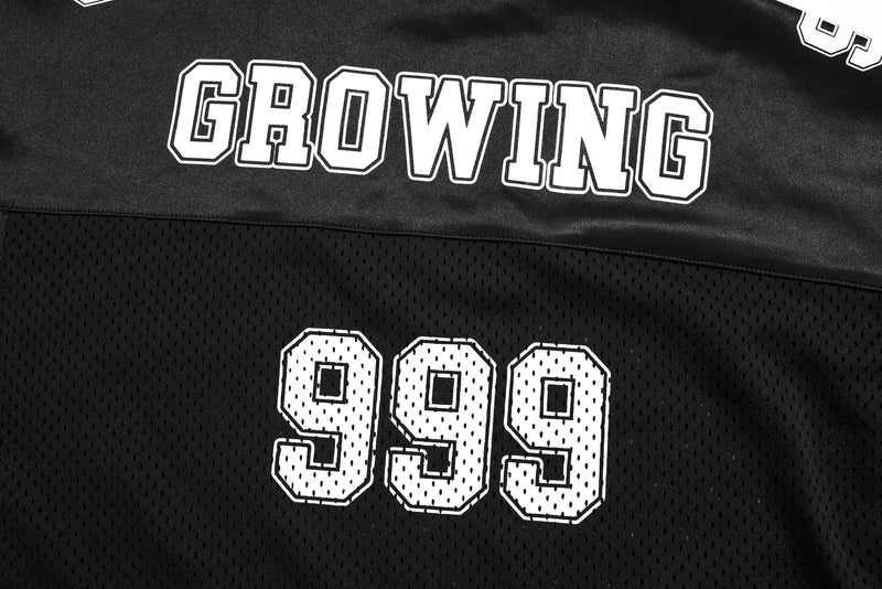 Black mesh varsity jersey tee with bold white GROWING and 999 graphic lettering