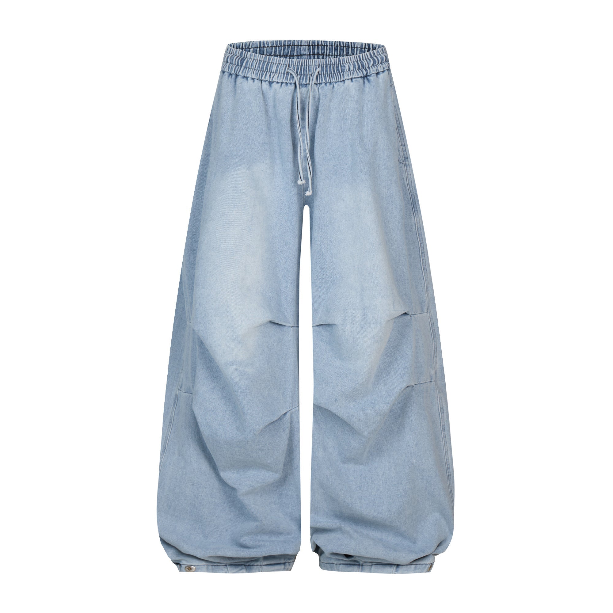 Front view of light wash oversized sculpted denim balloon pants with elastic drawstring waist and cinched hem