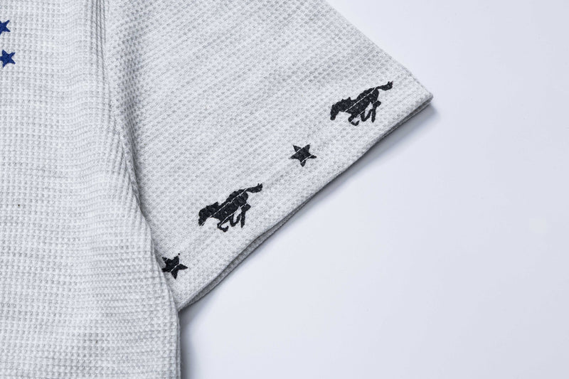 Light gray waffle-knit polo tee with black embroidered Mustang graphics and star accents on the sleeve