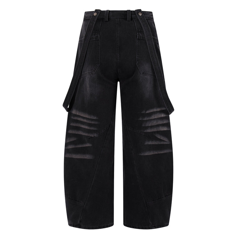 Back view of dark denim wide-leg jeans with strap details and faded knee accents