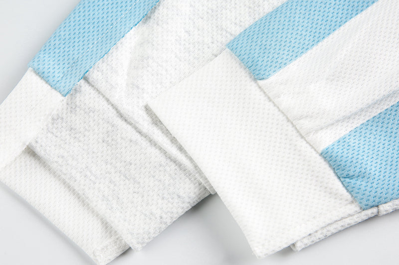 Close-up of sleeve cuff and seam details on white and light blue tee