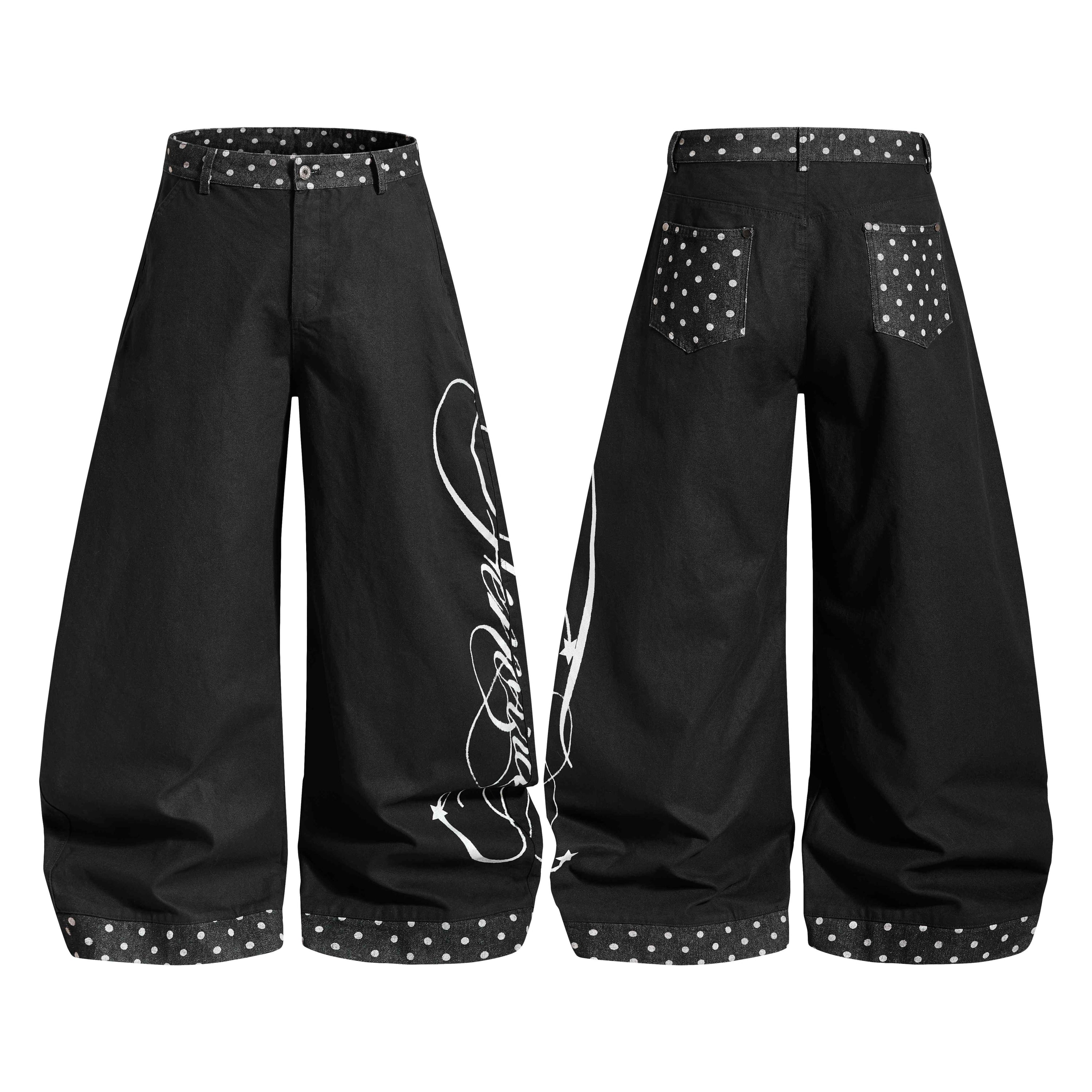 Black wide-leg denim jeans with polka dot waistband and hem cuffs, white script graphic print on right leg, front and back vi