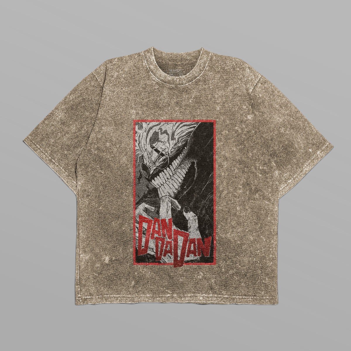 The Dandadan Monochrome Oversized T-Shirt features an abstract Okarun design with bold stylized character on brown texture. &quot;Pan Dan Dan&quot; pops in red and white within a framed red logo, capturing the playful spirit against a light gray backdrop.