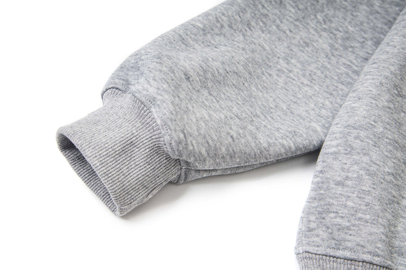 Close-up of light gray hoodie sleeve cuff with ribbed knit trim