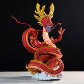 The Red Shenron Collectible Figure by Seakoff is a 30cm high-detail Dragon Ball Z dragon statue. It features shimmering red scales, golden horns, fierce eyes, an elongated coiled body with sharp claws, and a roaring mouth atop a cloud base against a dark background.