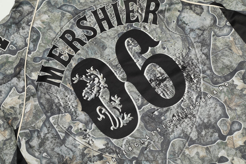 Close-up of back-center 06 print on camouflage mesh jersey with large black lettering