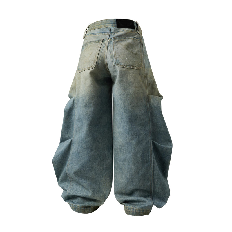 Back view of wide leg blue denim jeans with faded wash and back patch pockets