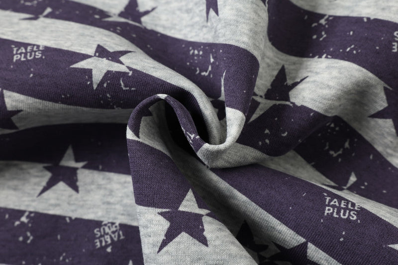 Close-up of folded purple and gray star print fabric on a zip-up hoodie