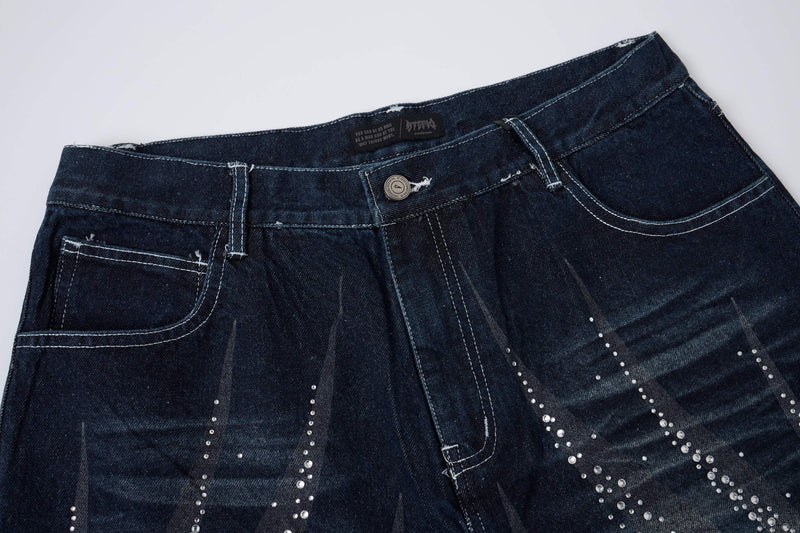 Close-up of dark wash denim shorts waistband and front pockets
