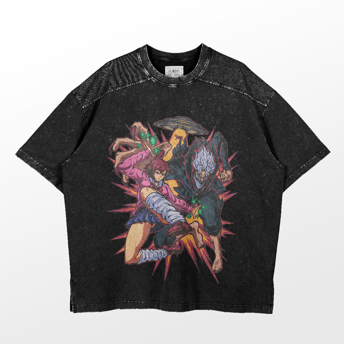 The Dandadan Oversized T-Shirt in premium 250 GSM cotton features a dynamic action trio design with a girl in pink, a masked character, green energy effects, and starburst background—a black tee embodying anime streetwear style with speckled texture for added flair.