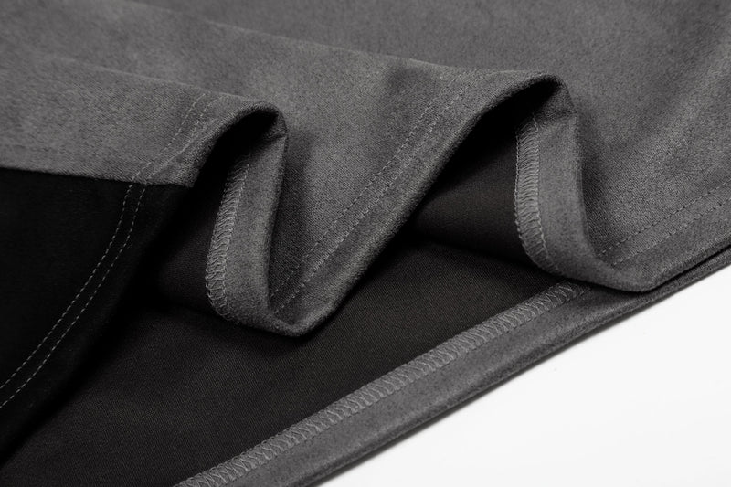Close-up of gray mesh jersey fabric with folded hems and visible stitching for a streetwear tee