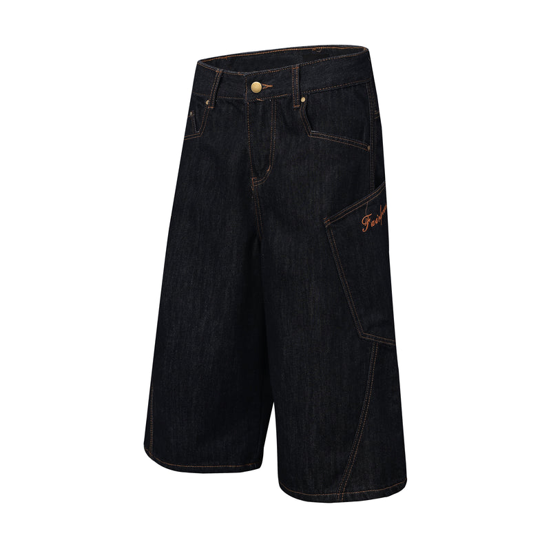 Angled front view of dark indigo denim jorts with wide legs, button waist, and plaid side panel