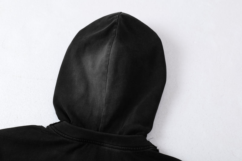 Close-up of the back hood on a black layered hoodie tee