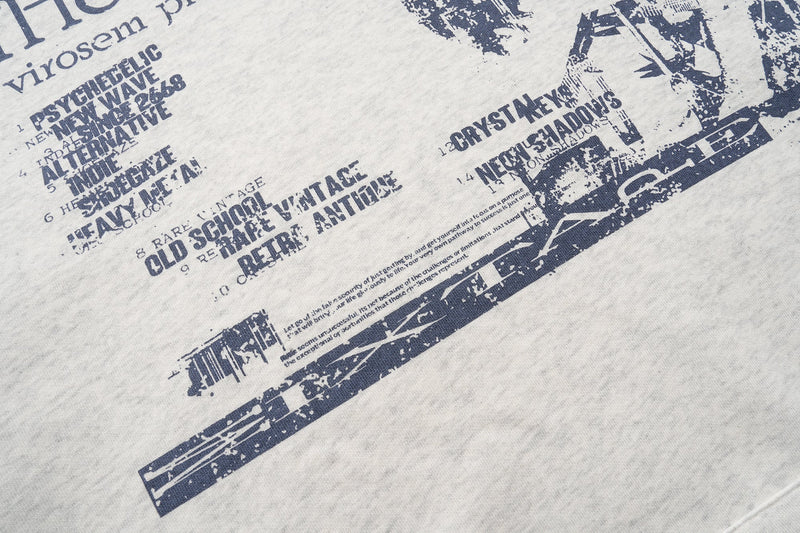 Front graphic details on heather gray hoodie with distressed text blocks