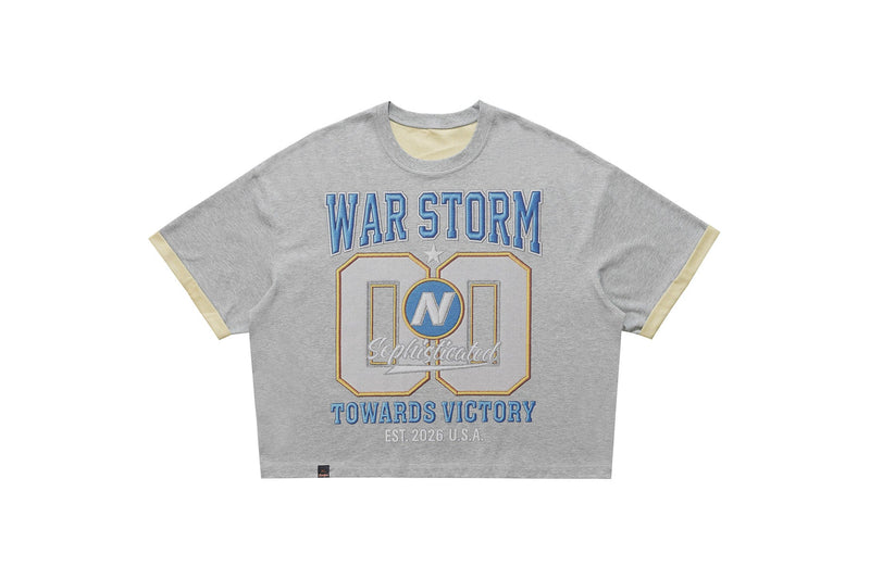 Gray varsity graphic tee with blue WAR STORM print, oversized 00 design, and contrast beige sleeve trim