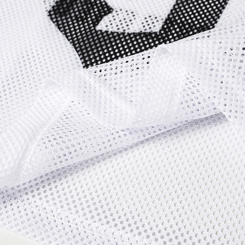 Close-up of white mesh football jersey fabric with black number 97 detail, featuring a sheer gothic streetwear texture