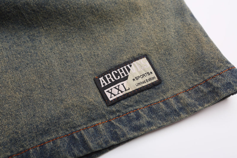 Close-up of bottom hem patch reading ARCHIVES XXL SPORTS Limited Edition