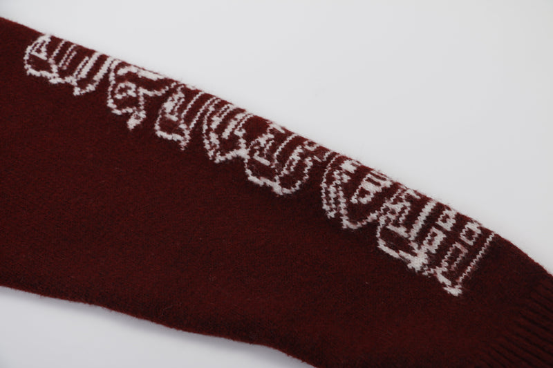 Close-up of burgundy sleeve graphic on knit hoodie