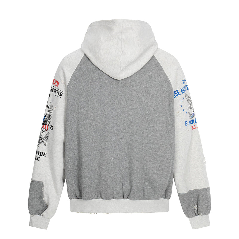 Back view of gray and white zip-up hoodie with raglan hood and graphic sleeve prints
