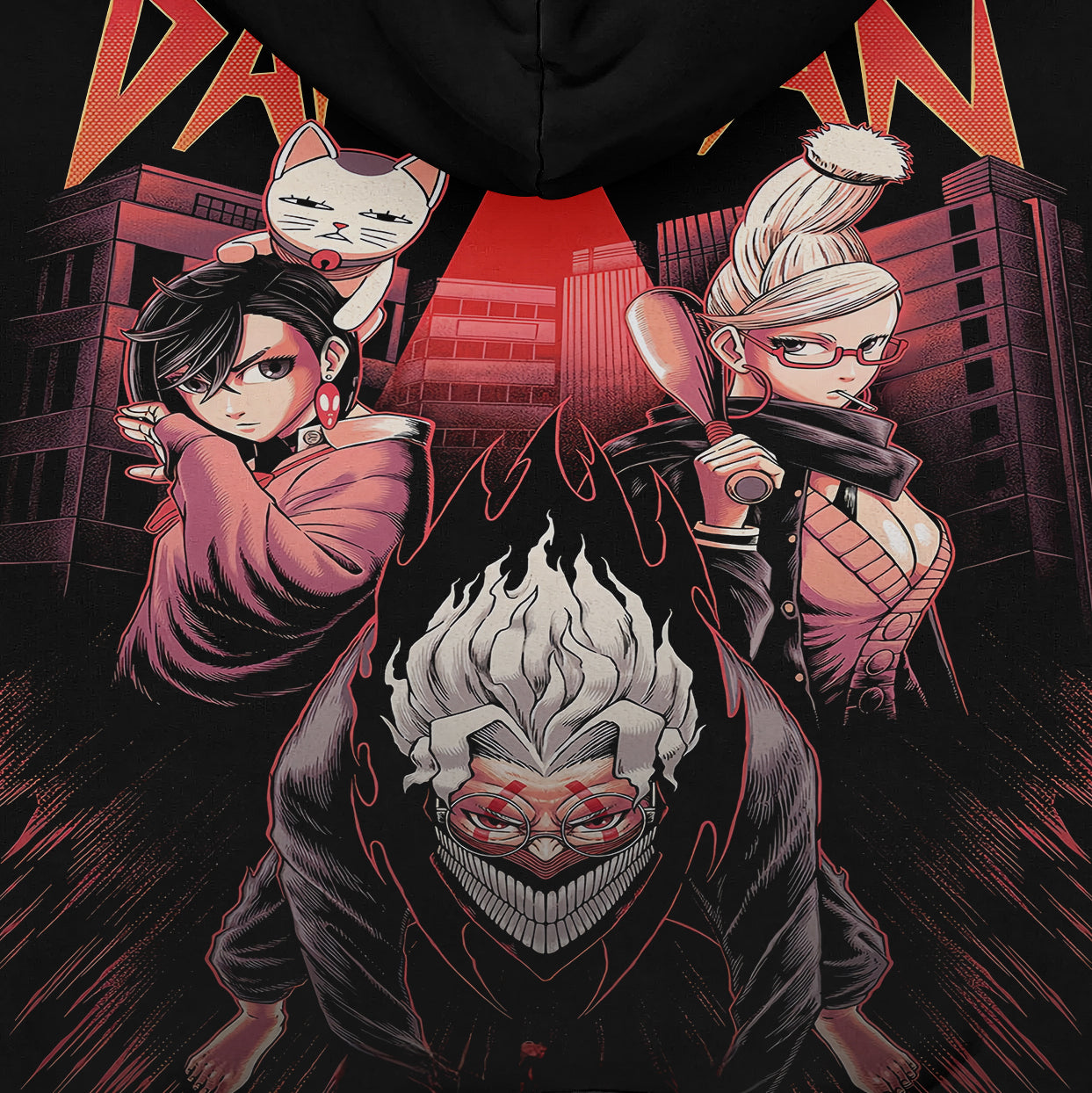 The Dandadan Hoodie features a group design with three anime characters against an urban backdrop, highlighting streetwear. The central white-haired figure has a fierce look, flanked by one with a mask and another with glasses holding a bat, set in a red and black color scheme. Made in premium 360 GSM cotton.