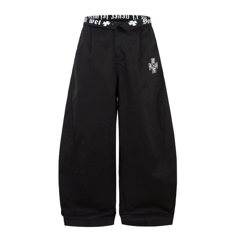 Front view of black barrel-leg pants with white graphic embroidery and a printed waistband