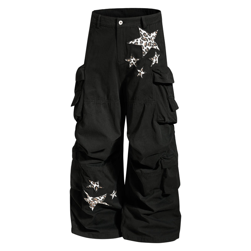 Black cargo pants front view with leopard star patches and wide legs