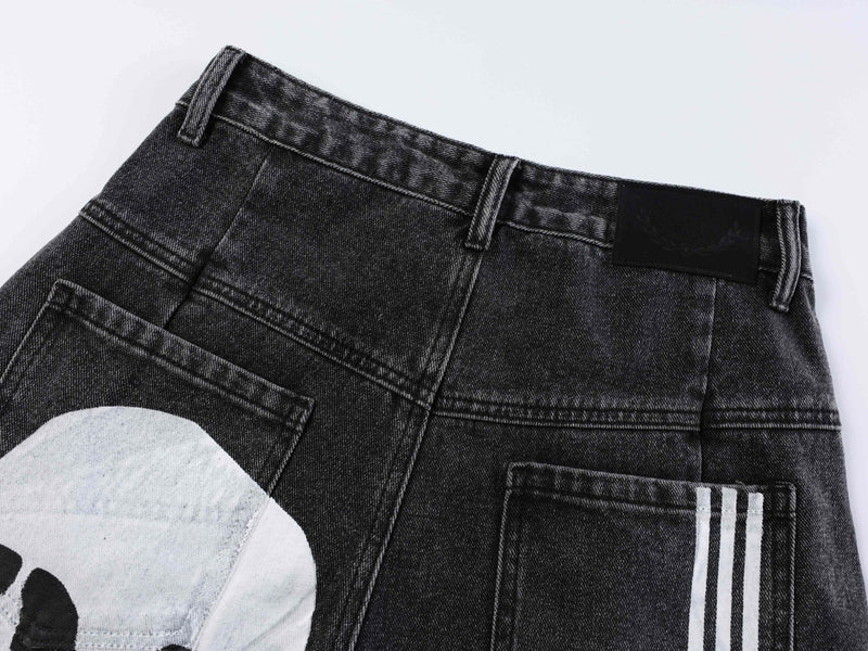 Close-up of black denim back waistband and patch label