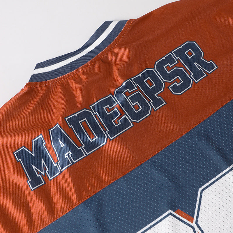 MADEGPSR varsity football jersey with orange and navy star stripe mesh fabric and bold front lettering