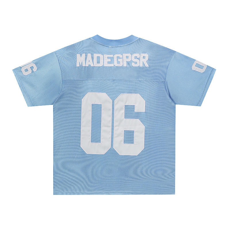 Light blue retro football jersey tee with white number 06 and varsity-style lettering on back