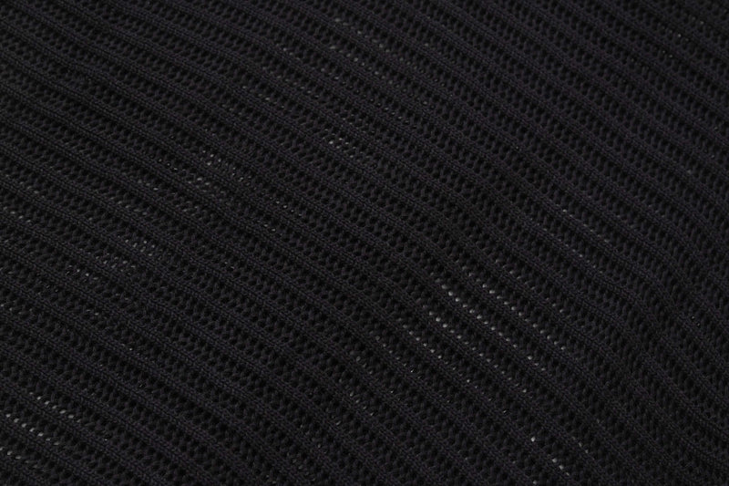 Close-up of black open-knit fabric with a star-like textured pattern from the Seakoff short-sleeve button-up shirt