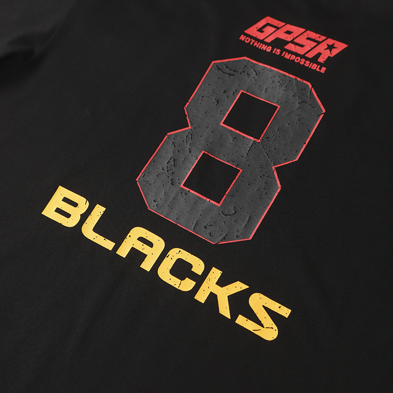 Black cotton tee with oversized red number 8 and yellow BLACKS racing graphic print on the front