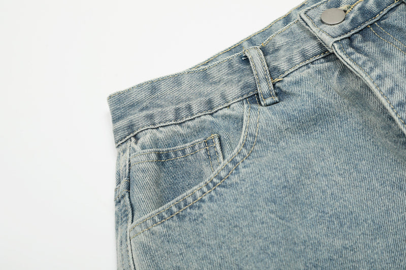 Light wash denim front waistband and pocket seam detail