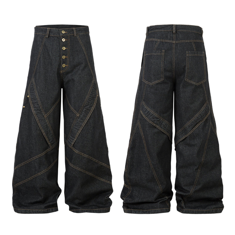 Front and back view of dark wide-leg denim pants with geometric multi-panel seams and gold contrast stitching