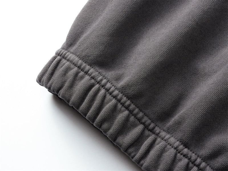 Close-up of black hoodie hem with ribbed elastic trim