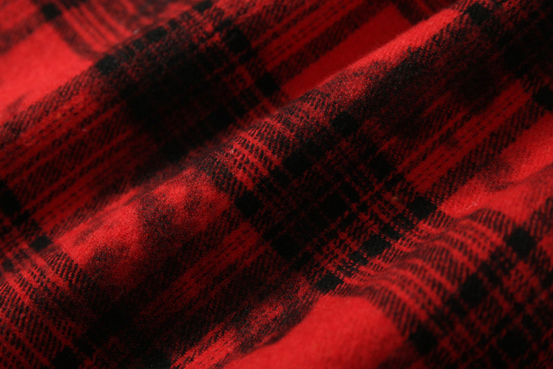 Close-up of red and black plaid fabric with soft brushed texture