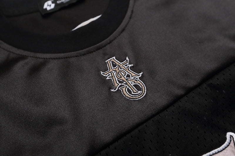 Black mesh football jersey T-shirt with embroidered gothic monogram and curved collar detail