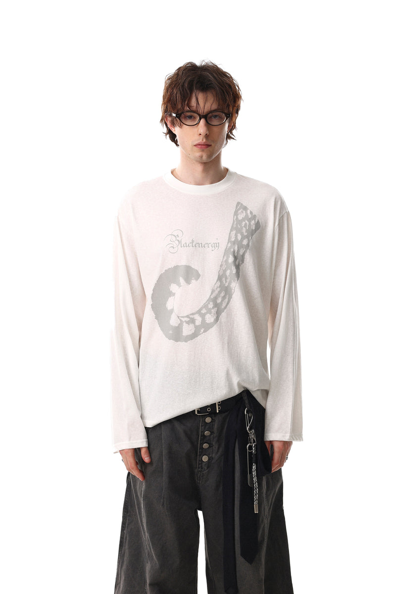White long sleeve tee worn with front graphic and relaxed fit