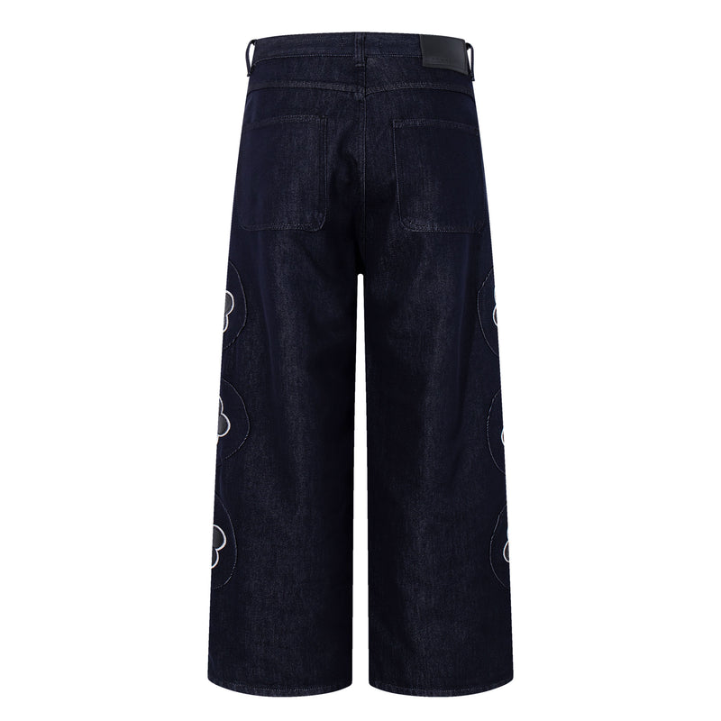Dark wash wide-leg jeans, back view with rear pockets and floral patch accents at the sides