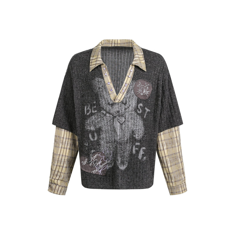 Black ribbed knit sweater with plaid collar, layered sleeves, and bear graphic front view