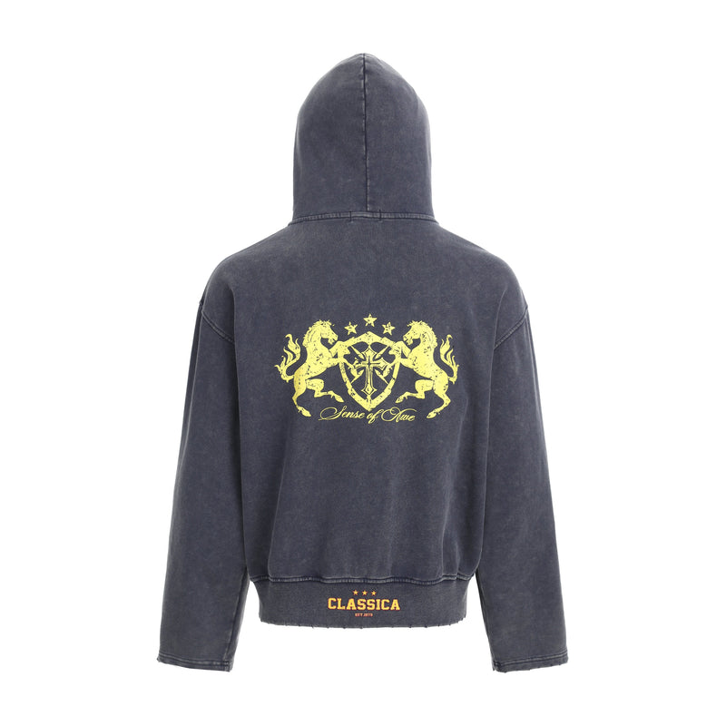 Dark washed hoodie back view with large yellow crest graphic and ribbed hem
