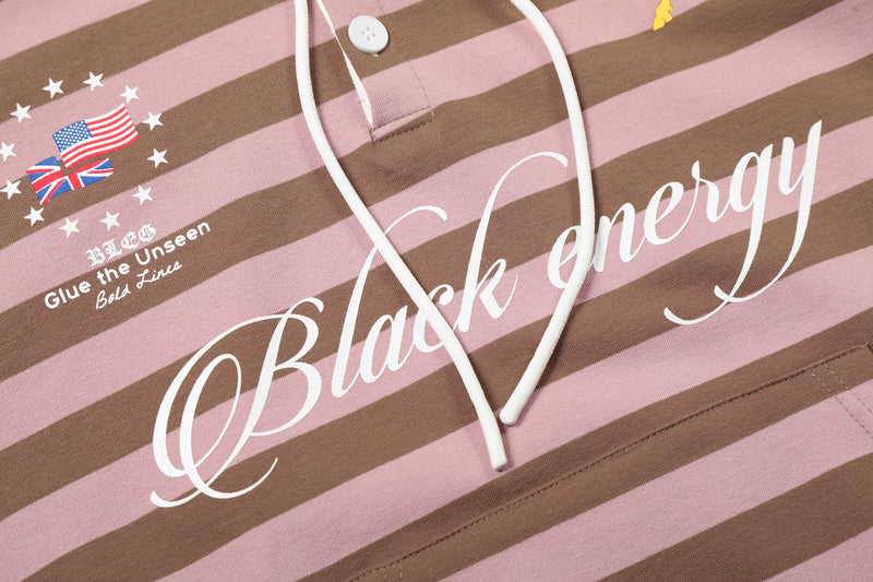 Close-up of large cursive front text and drawstrings on pink and brown striped hoodie