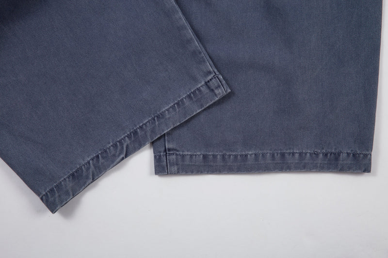 Hem close-up of blue denim pants with cuffed wide-leg opening