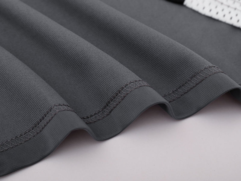 Close-up of gray sleeve hem stitching and fabric texture