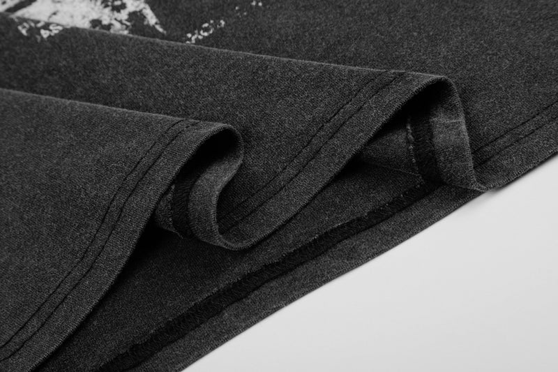 Washed black vintage streetwear T-shirt with folded hem and soft faded fabric texture